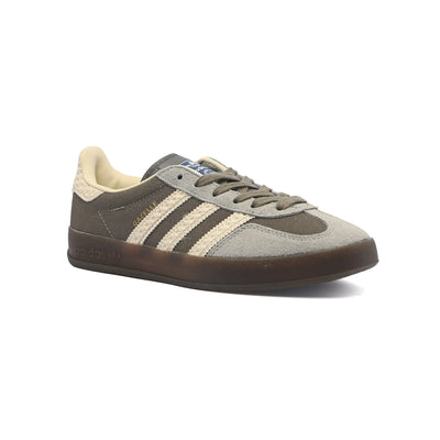 The Adidas Gazelle Woman Indoor features a grey suede upper and a semi-translucent rubber outsole IF1807-W