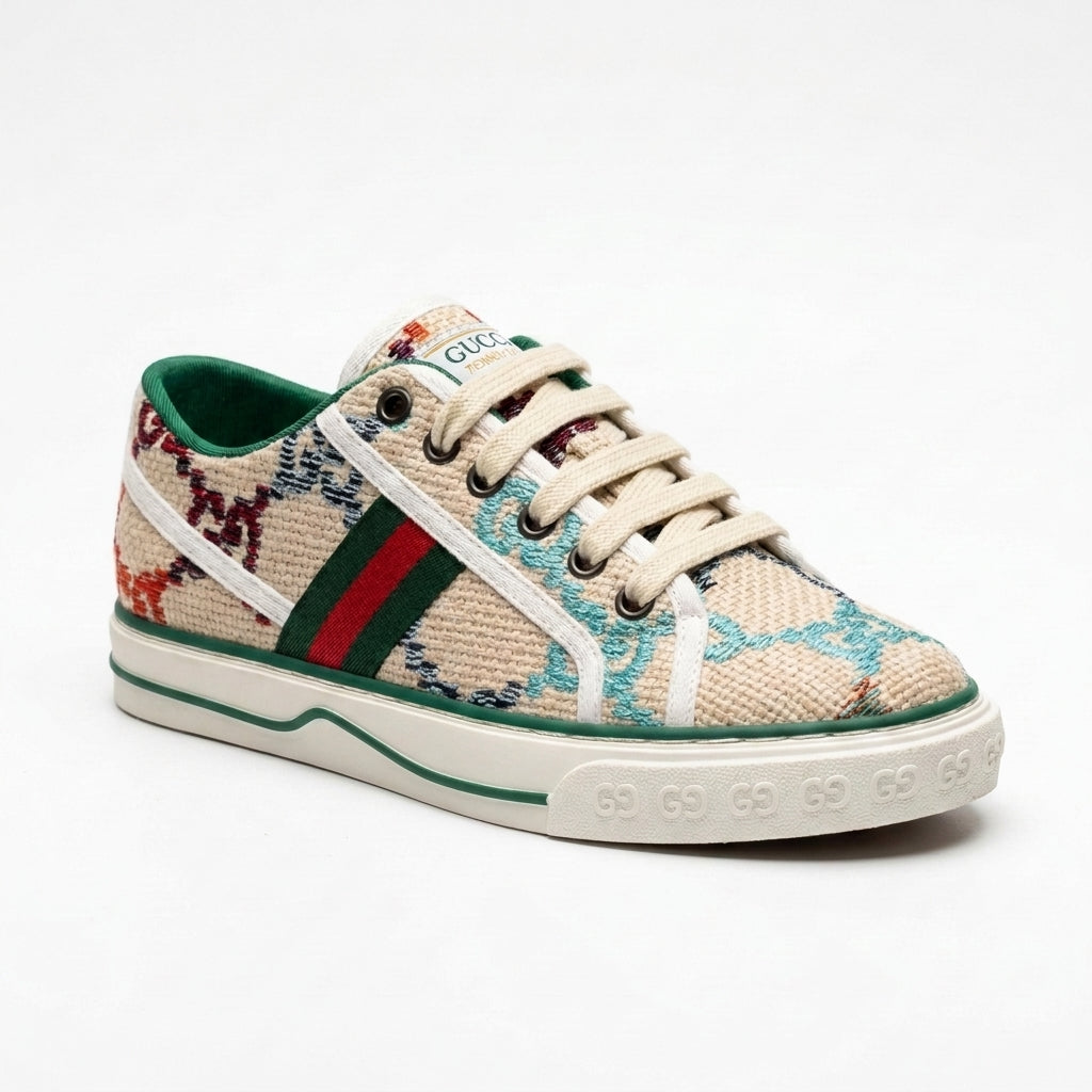 Gucci women's sneakers featuring a multicolored embroidered GG pattern, accented with the green and red Web stripe and green leather trim Beige G2949. - 1