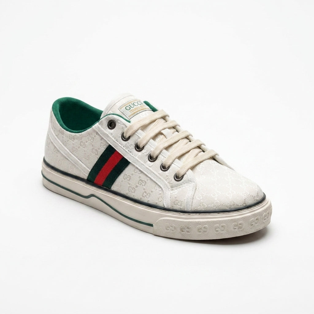 Gucci women's sneakers crafted from white jacquard fabric featuring a small GG pattern and the signature green and red Web stripe CC887. - 1